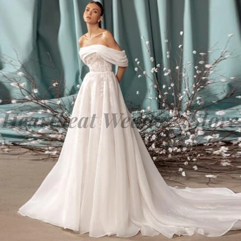 Класическа сватбена рокля трапецовидна форма, с влак, без презрамки, с открити рамене, аппликацией, без табли, 2023, жената женствена рокля